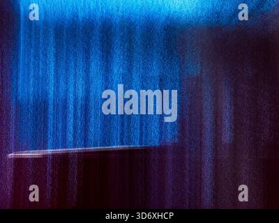 Dynamic abstract background showing vertical blue and purple light streaks with motion blur, creating a vibrant textured surface and a horizontal whit Stock Photo