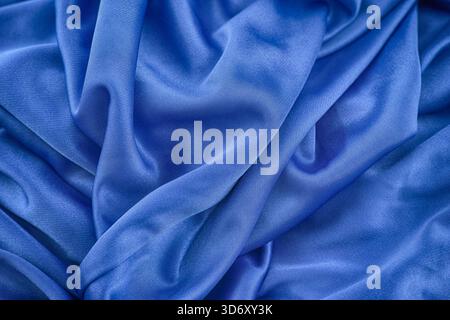 A blue wrinkled fabric texture background. Close up. Stock Photo