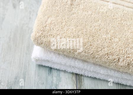 Two towels on wooden table, spa time Stock Photo