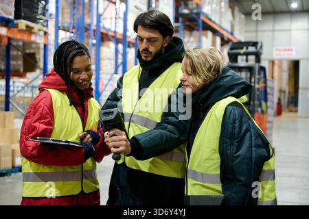 Warehouse workers checking inventory in cold storage Stock Photo