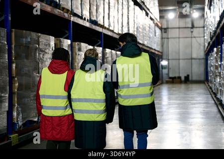 Logistics personnel working in cold chain storage facility Stock Photo
