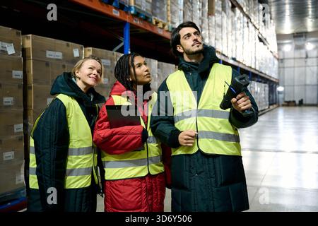 Warehouse workers controlling inventory in cold chain storage Stock Photo
