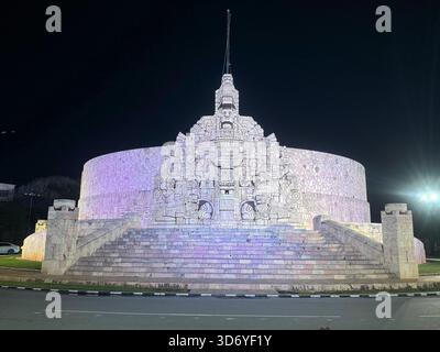 Illuminated night view of Monumento a la Patria in Mérida, Rómulo Rozo’s 1956 Maya-carved tribute glowing with eagle and serpent motifs,Merida,Yucatan Stock Photo