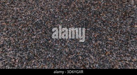 panorama view from above on surface of small pebbles and stones on sea coast Stock Photo