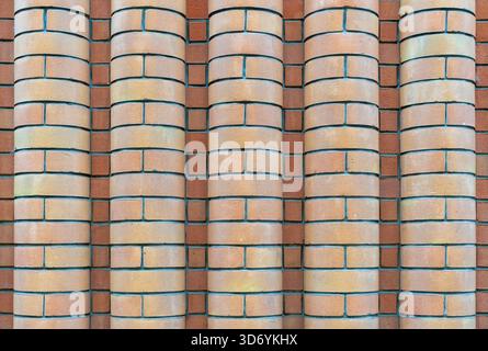 Old wall of curved bricks Stock Photo