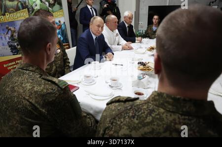Putin visits Russian military hospital, speaks with casualties of his invasion of Ukraine. Stock Photo