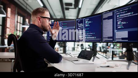 The Frustrated Web Developer At His Boring Desk Job. Stock Photo
