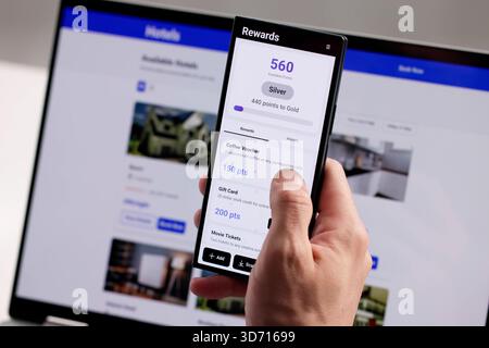 Man Earns Loyalty Points Using Smartphone App For Retail Rewards. Stock Photo