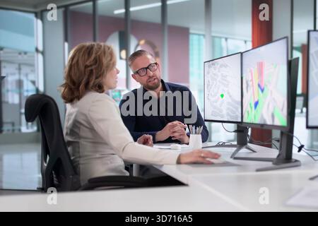 Engineers Are Using GIS Software To Inspect Construction Project Valuation. Stock Photo