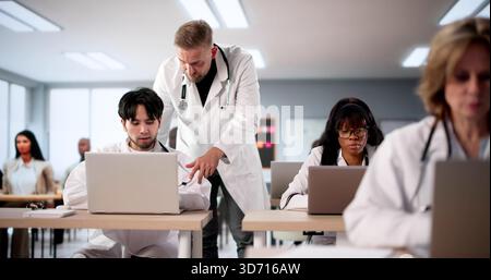 Medical Students Learning About Healthcare From Teacher In A University Classroom. Stock Photo