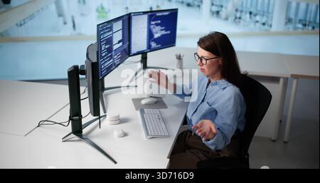 Unhappy Woman Programmer Frustrated With Broken AI Chatbot Workflow System. Stock Photo