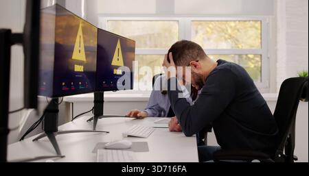 Troubleshooting A System Error On The Computer Software Screen. A Hacker Breach Causing Software Problems Stock Photo