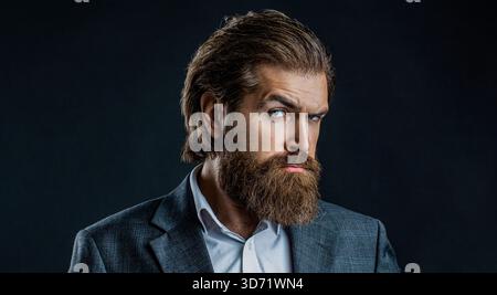 Perfect beard. Bearded man, stylish hairstyle. Portrait of stylish professional hairdresser with beard. Man wearing suit Stock Photo
