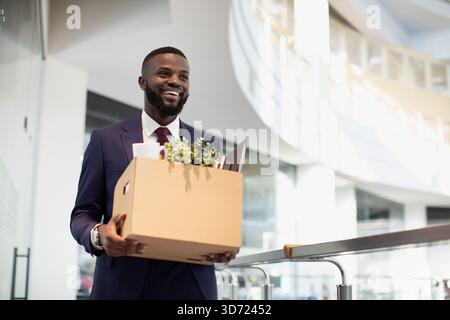Happy african american young man with working stuff Stock Photo