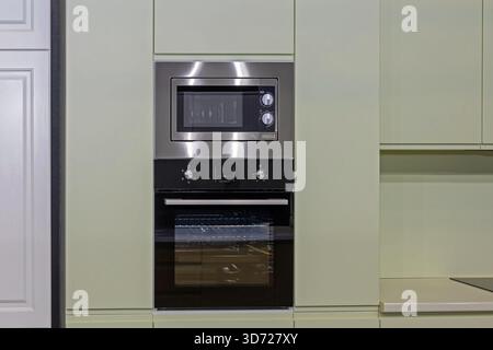 Modern kitchen interior with built in oven and microwave devices Stock Photo