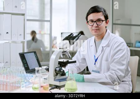 Portrait of Young Adult Man Conducting Research in Medical Laboratory Stock Photo