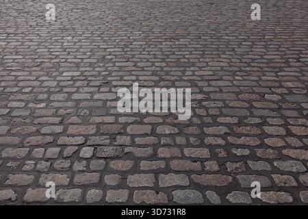Close-up of setts pavement, which are quarried stones that are cut into a roughly rectangular or square shape, Pitkäsilta, Helsinki, Finland. Stock Photo