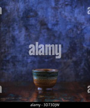 Traditional, handcrafted ceramic on wooden background. Soft focus. Copy space. Stock Photo