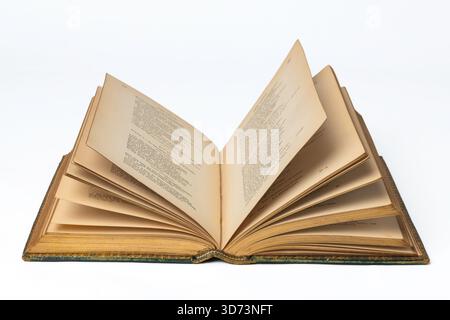Antiquarian book open on a white surface Stock Photo