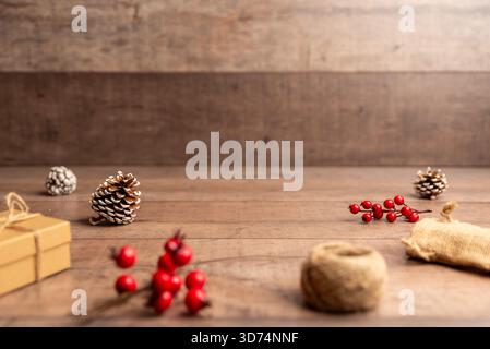 Christmas flat lay background with pinecones, berries and rustic wood surface, perfect for holiday designs, copy space layouts, winter campaigns and f Stock Photo