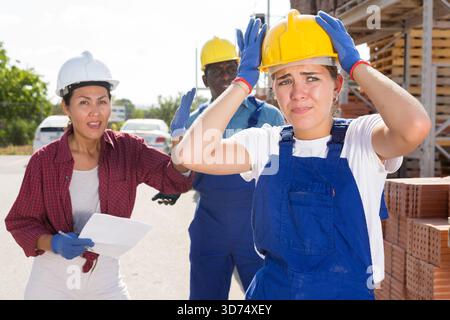 Workers have problems at work at a hardware store Stock Photo