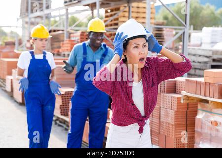 Workers have problems at work at a hardware store Stock Photo