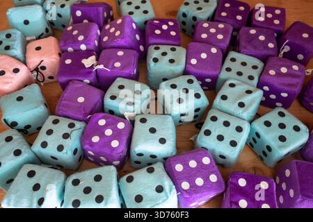 A pile of turquoise and purple fuzzy dice. Stock Photo