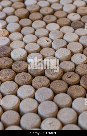 Close-up of many wine corks laid out in a dense background. Stock Photo
