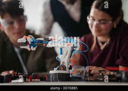 High school students working on robotics project. High schoolers in STEM. Stock Photo