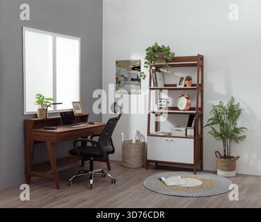 Minimalist Home Office Interior with Wooden Desk, Shelves, and Indoor Plants Stock Photo