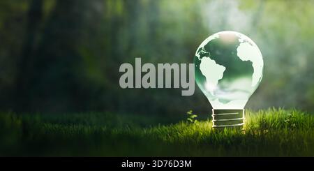 Sustainable earth globe light bulb on grass copy space.3d rendering Stock Photo