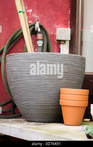 Ourdoor, Empty flower pots on the ground in the garden Stock Photo