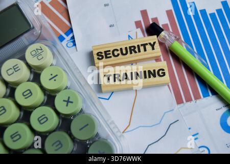 Security training text stacked wooden cubes on the table. Stock Photo
