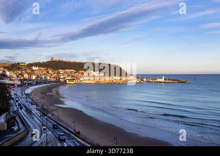 The headland at Scarborough has provided shelter from Northerly storms and has been a safe haven for settlement for over three thousand years Stock Photo