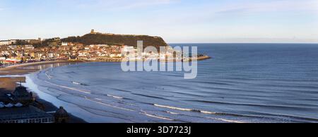The headland at Scarborough has provided shelter from Northerly storms and has been a safe haven for settlement for over three thousand years Stock Photo