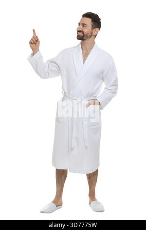 Man in bathrobe pointing at something on white background Stock Photo