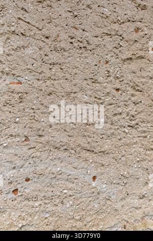Old wall made of mud and stones Stock Photo