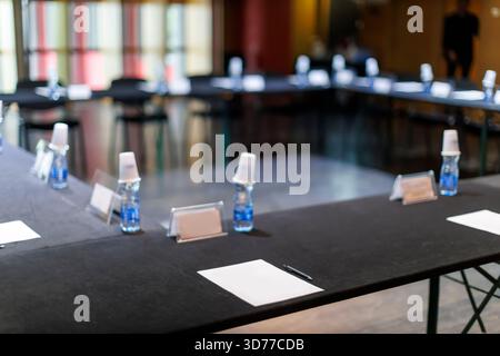Empty conference table with papers and pens ready for a meeting Stock Photo