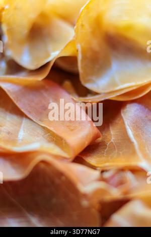 Close up of thinly sliced prosciutto ham Stock Photo