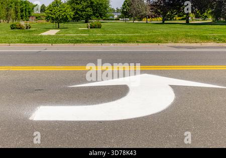 detail image of a large white arrow indicating a left turn Stock Photo