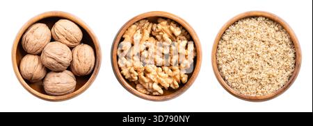 Walnuts, with and without shells, and ground, in wooden bowls. Dried walnuts, seeds of walnut tree Juglans regia. Stock Photo