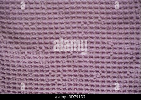 The texture of a waffle purple towel Stock Photo