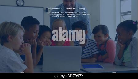 Gathering teacher and students leaning over laptop in classroom, with tablet and code overlay Stock Photo