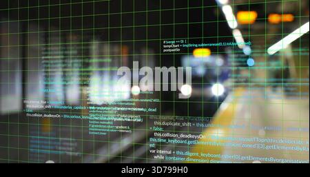 Displaying faint green grid overlay with floating code in subway tunnel, twin headlights glaring Stock Photo