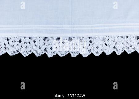 White lace trim on black background vintage cupboard Stock Photo