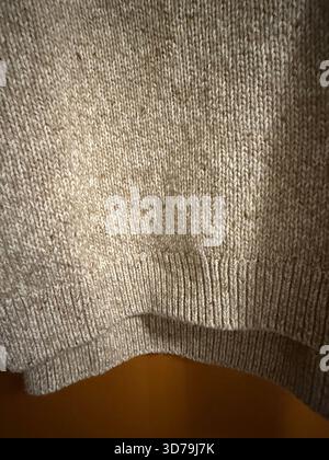 Textured beige fabric with ribbed pattern creates a neutral abstract textile background. Mobile photo Stock Photo