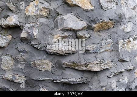 Stone wall texture with plaster background Stock Photo