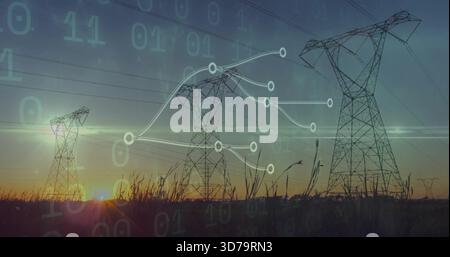 Silhouetting lattice steel towers and power lines over tall grass at sunset, showing data network Stock Photo