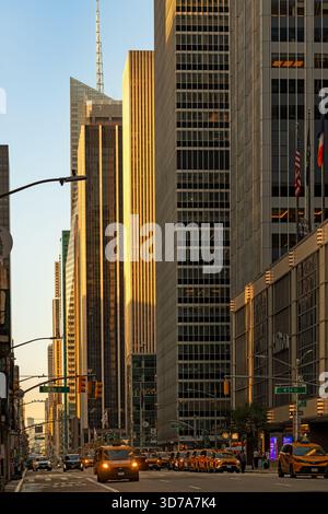 New York City, NY, United States: The bustling atmosphere of New York City on Sixth Avenue, also known as Avenue of the Americas. Stock Photo