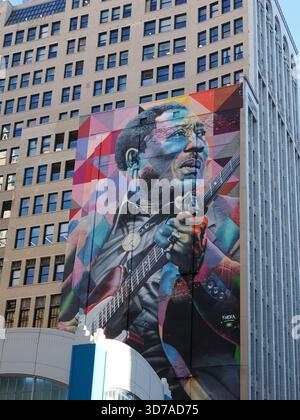 Chicago, IL - September 17, 2025: Close, vertical view of the massive Muddy Waters mural by artist Kobra dominating the side of a downtown skyscraper. Stock Photo